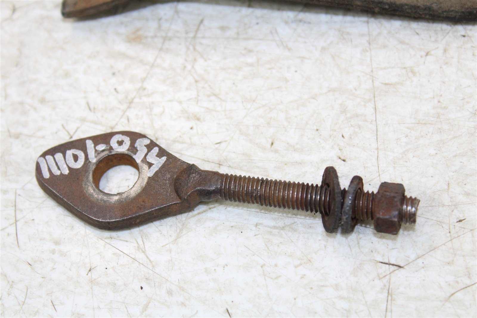 1985 Honda Fourtrax TRX 125 Chain Guide Guard w/ Axle Adjuster Bolt