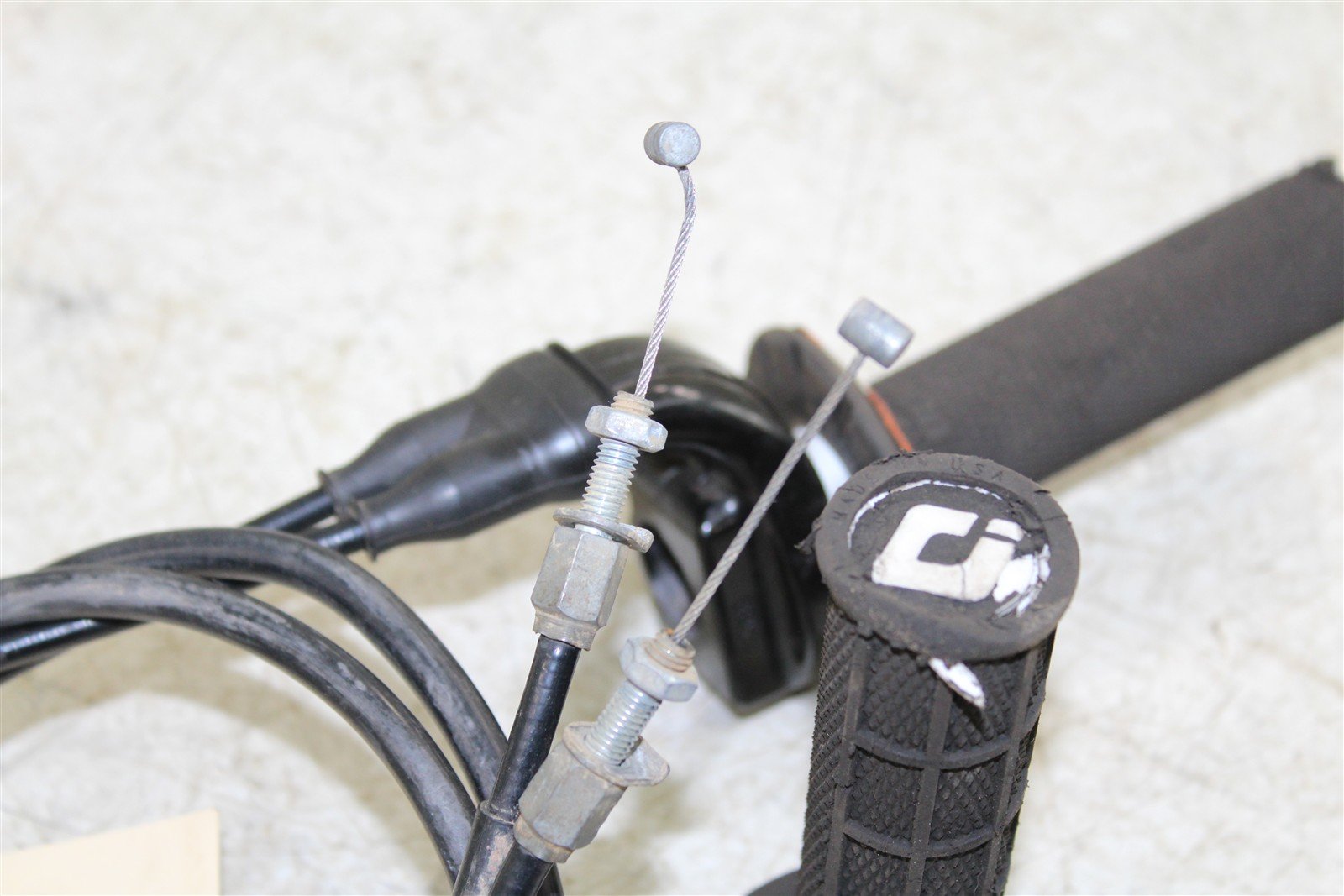 2009 Kawasaki KX 250F Throttle Housing Tube w/ Cables ODI Lock On Grips 27039